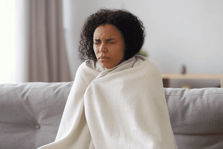 woman cold in blanket